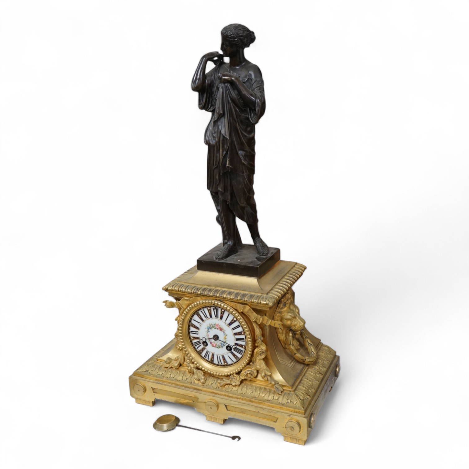 A 19th century French gilt bronze mantel clock, with classical figural surmount and floral painted dial, clock 54cm high.